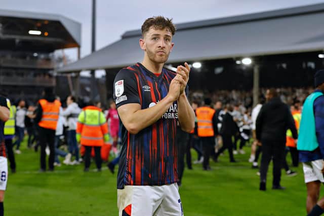Tom Lockyer applauds the Hatters at Fulham