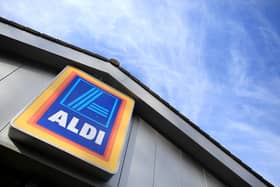 An exterior view of signage at a branch of the budget supermarket Aldi (Photo by Matt Cardy/Getty Images)