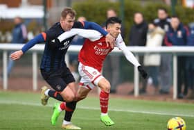 James Bree challenges Arsenal's Gabriel Martinelli in their friendly at London Colney