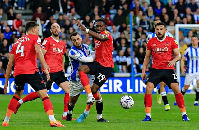 Amari'i Bell comes under pressure against Huddersfield