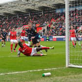 Cauley Woodrow scores the rebound after his penalty was saved against Rotherham - pic: Gareth Owen