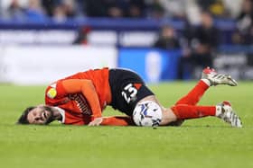 Luton midfielder Henri Lansbury picked up a neck injury during Monday night's defeat to Huddersfield