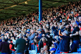 Luton's fans stand up to applaud as a mark of respect for Queen Elizabeth II during Town's 2-0 win over Blackburn Rovers on Saturday