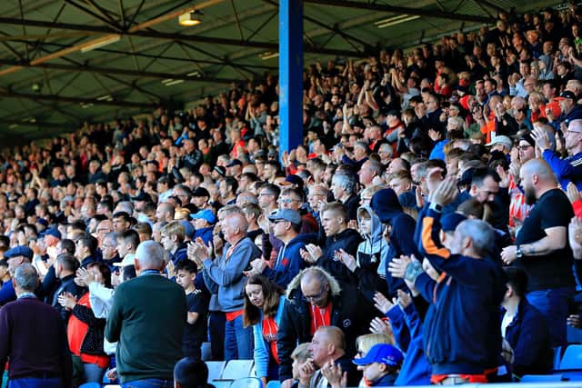 Luton's fans stand up to applaud as a mark of respect for Queen Elizabeth II during Town's 2-0 win over Blackburn Rovers on Saturday