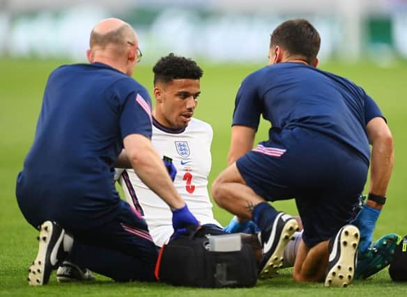 James Justin receives treatment during England's 1-0 loss to Hungary on Saturday