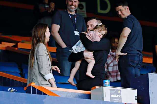 Hatters boss Nathan Jones celebrates victory with his wife and daughter