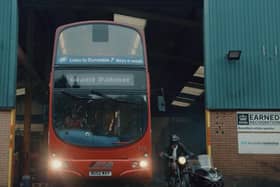 Bus and motorbike emerge from depot, ready to race to Luton. Picture: Grant Palmer