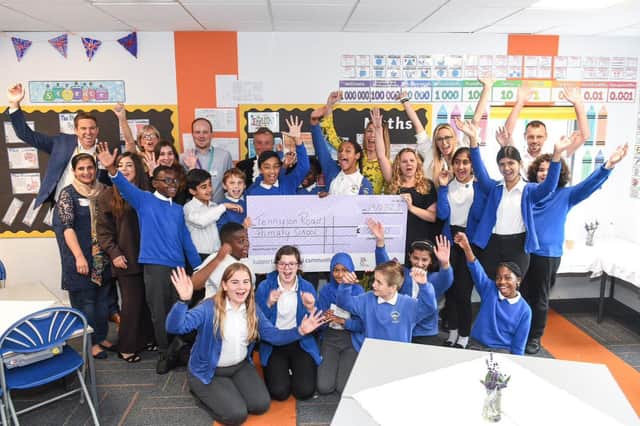 Tennyson Road Primary School receives a cheque for the development of an outdoor learning space from London Luton Airport. Pic supplied by London Luton Airport