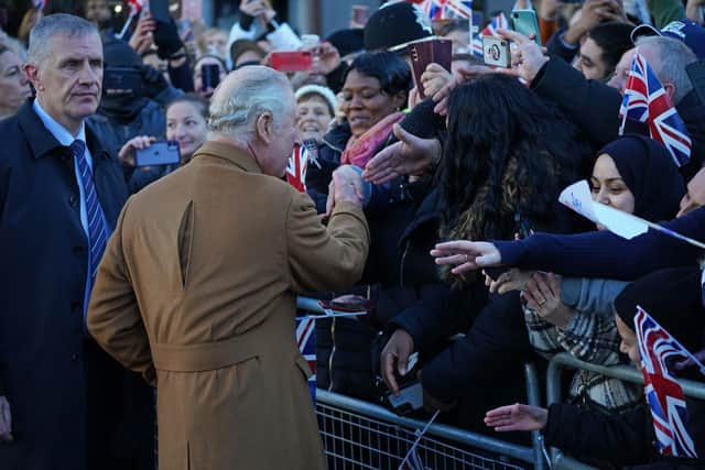 A close-protection officer (left) watches the crowd as King Charles III meets members of the public PIC: Yui Mok/PA Wire