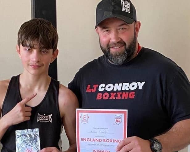 Liam Conroy of Dunstable's Ringcraft boxing club with protege Ajay - one of the club's most dedicated young fighters who became Home Counties champion only two years after starting the sport