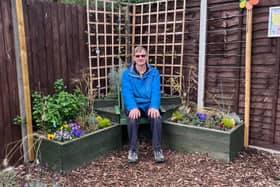 Stopsley Baptist Church volunteer David Crowhurst takes time out to enjoy the dementia friendly garden he helped create