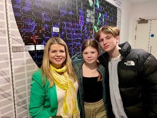 Louise Fox with her children Issy and Jamie at the brain tumour cancer research centre's Wall of Hope