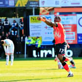 Pelly-Ruddock Mpanzu celebrates his second goal against Blackpool