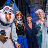 Elsa, Anna, and Olaf from Disney's "Frozen" pictured with voice of Elsa Idina Menzel at Disney's Hollywood Studios theme park in Lake Buena Vista, Florida (Photo by Matt Stroshane/Disney Parks via Getty Images)