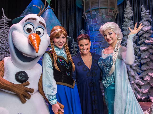 Elsa, Anna, and Olaf from Disney's "Frozen" pictured with voice of Elsa Idina Menzel at Disney's Hollywood Studios theme park in Lake Buena Vista, Florida (Photo by Matt Stroshane/Disney Parks via Getty Images)