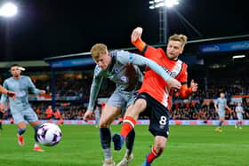 Luke Berry gets stuck in against Everton during one of his final appearances for the Hatters - pic: Liam Smith
