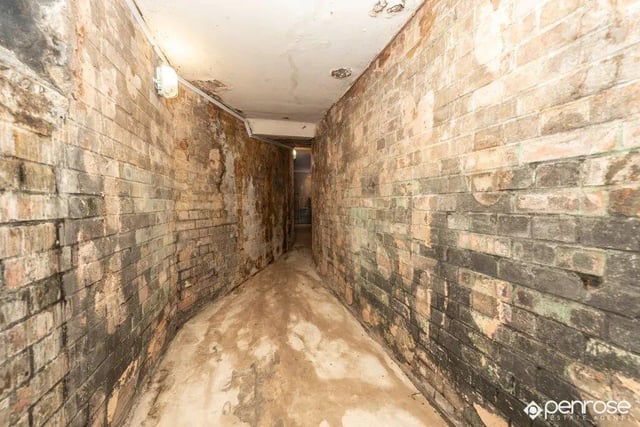 The property has two original cellar rooms below ground, with a unique underground tunnel