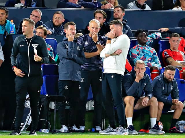 Luton boss Rob Edwards in talks with his backroom staff - pic: Liam Smith