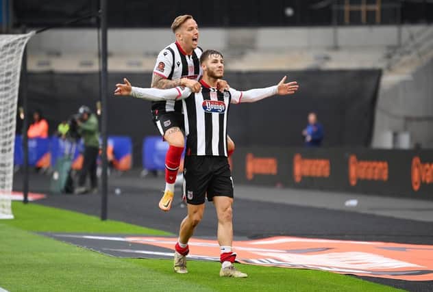John McAtee celebrates scoring for Grimsby in the National League play-off final last season