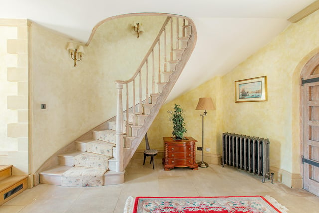 These stairs go up to five bedrooms, five bathrooms, a reception room and a dressing room