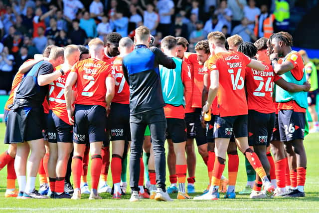 Luton's players go into a huddle after beating Nottingham Forest