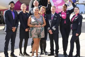 Wizz Air team holds a celebratory sign at Luton Airport. (Picture: Wizz Air)