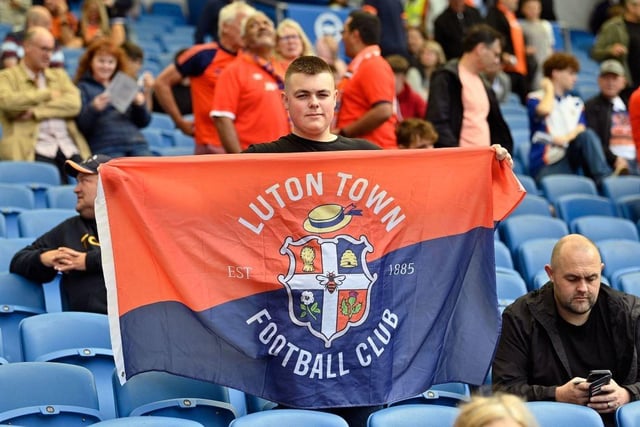 A Luton fan with his flag ahead of kick-off at the Amex Stadium.