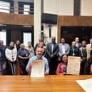 Mark Fowler and Cllr Maria Lovell MBE signing the Anti-Racism Charter