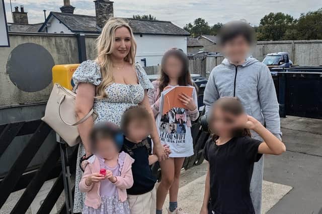 Michelle Roberts, with her children.