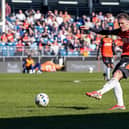 Kal Naismith drives the ball goalwards against Stockport County recently - pic: David Horn / PRiME Media Images
