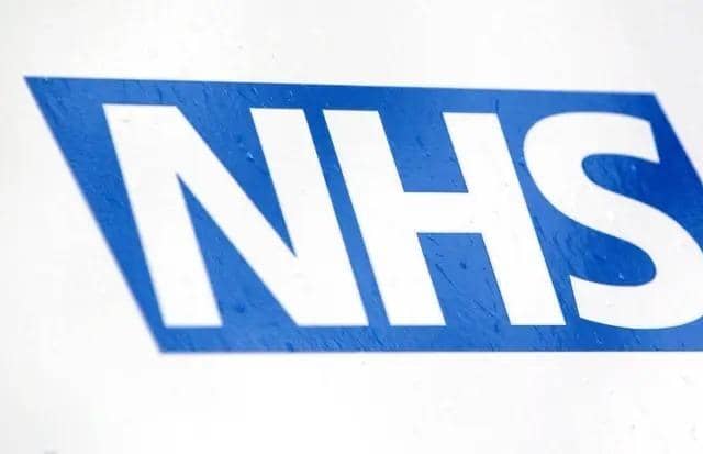 NHS logo, photo from Yui Mok/ PA Wire/PA Images
