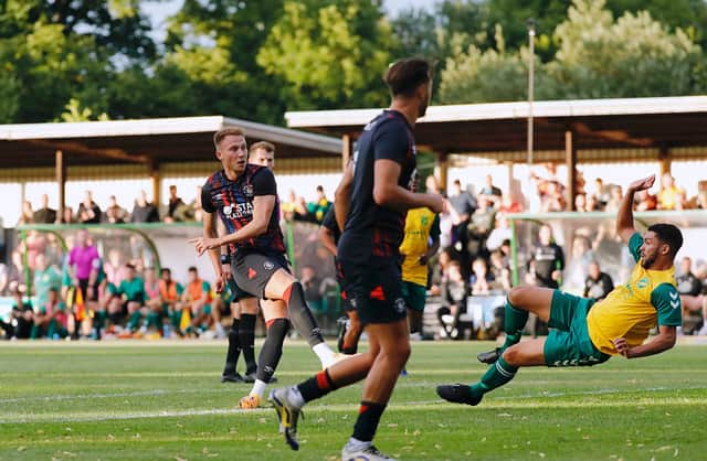 Cauley Woodrow finds the net during Town's pre-season friendly win over Hitchin Town