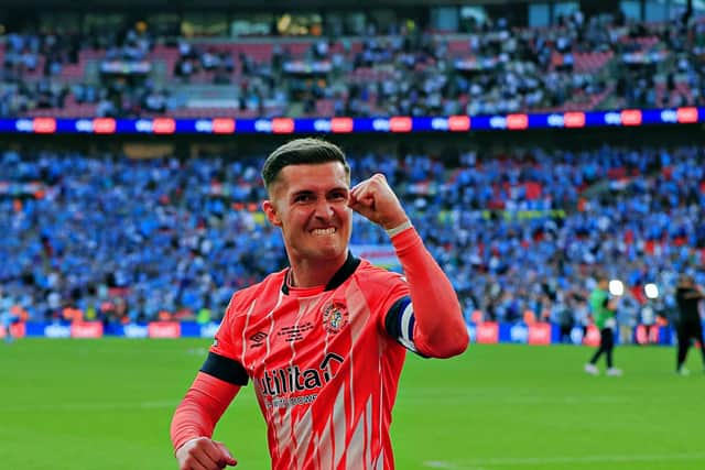 Town defender Dan Potts celebrates at Wembley