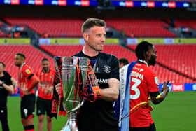 Town boss Rob Edwards with the Championship play-off winners' trophy