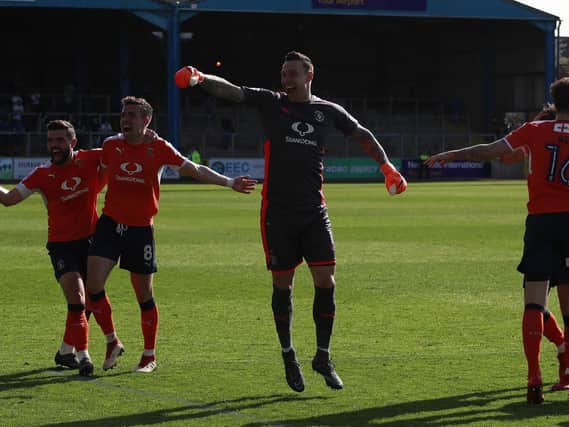 The Hatters celebrate winning promotion at Carlisle