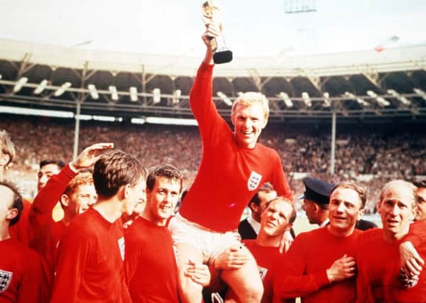 Bobby Moore holds aloft the Jules Rimet World Cup trophy in 1966 Picture: Popperfoto/Getty Images)