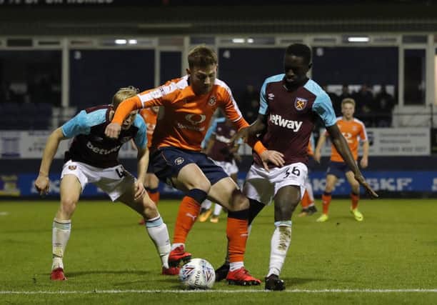 Jordan Cook holds the ball up against West Ham U21s