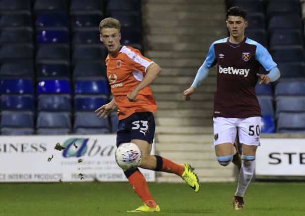 Kavan Cotter plays the ball forward during Town's Checkatrade Trophy win over West Ham U21s