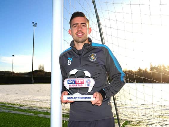Hatters midfielder Olly Lee with his Goal of the Month trophy