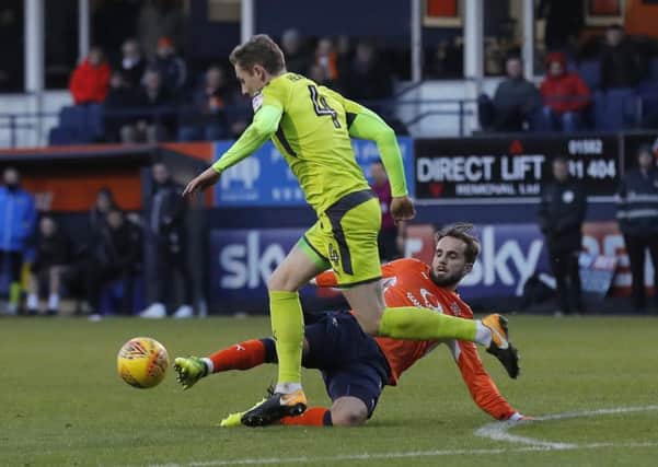 Andrew Shinnie slides in against Notts County last weekend