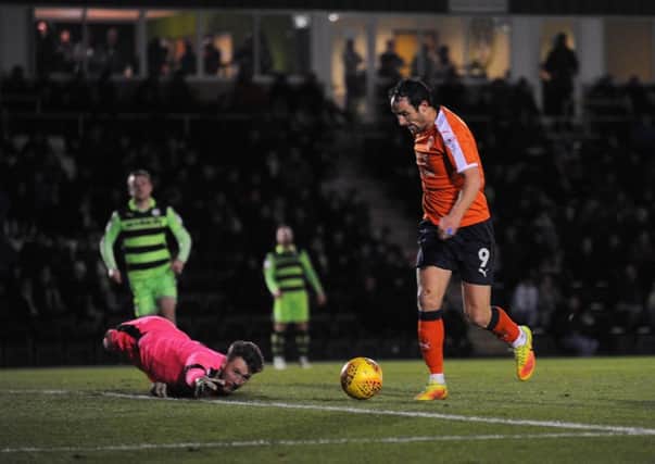 Striker Danny Hylton is about to tap in his 14th of the season
