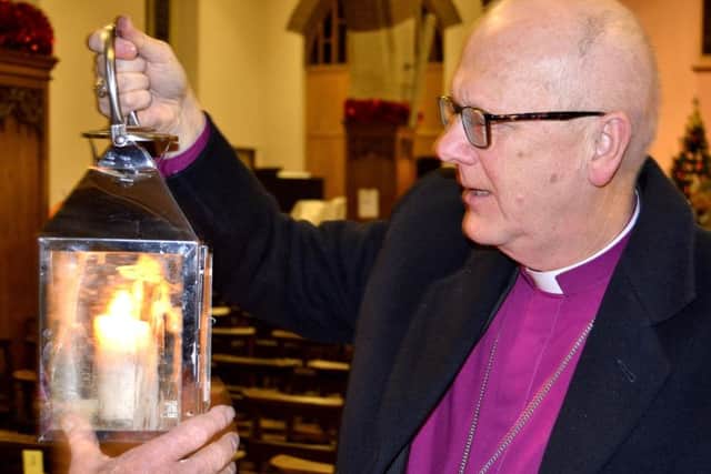 The Bishop of St Albans with the peace light.