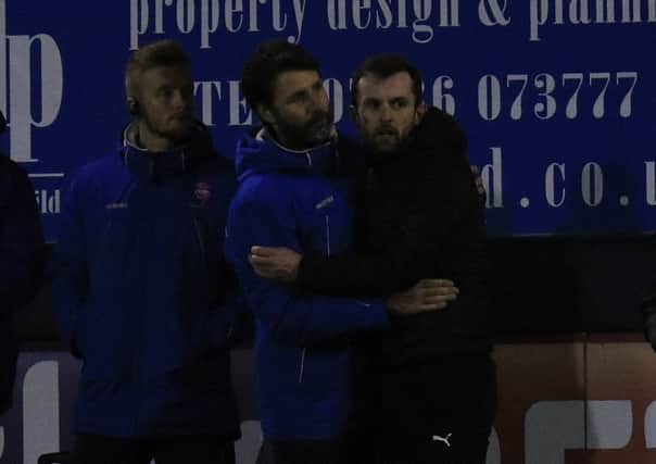 Hatters boss Nathan Jones and Lincoln chief Danny Cowley after the game