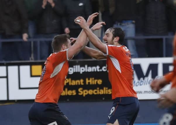 Danny Hylton and James Collins celebrate Town's leveller against Lincoln