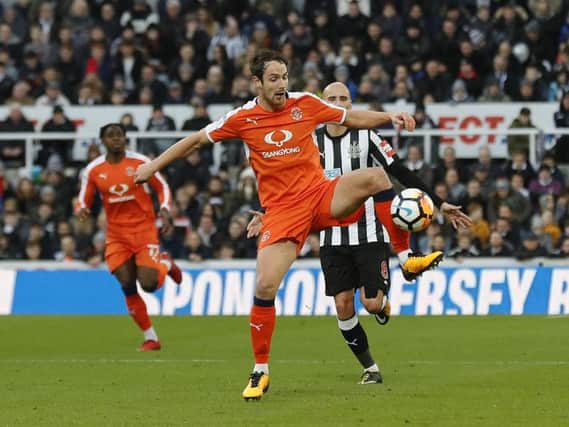 Danny Hylton controls against Newcastle United this afternoon
