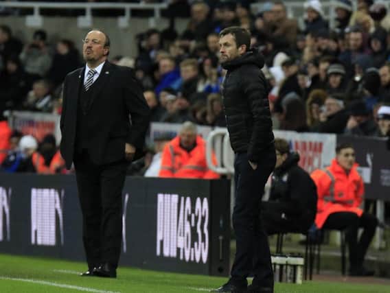 Hatters boss Nathan Jones and Newcastle chief Rafa Benitez patrol the touch-line