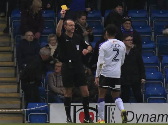 James Justin is booked by referee Carl Boyeson at the weekend