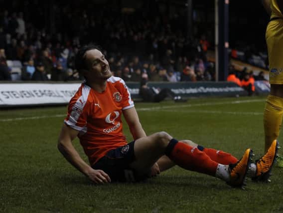 Danny Hylton suffers a hamstring injury against Morecambe