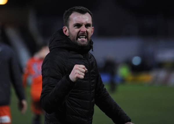 Nathan Jones celebrates his side's 1-0 win at Grimsby