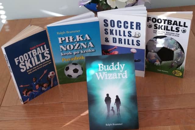 Buddy Wizard with Ralph's books about football.